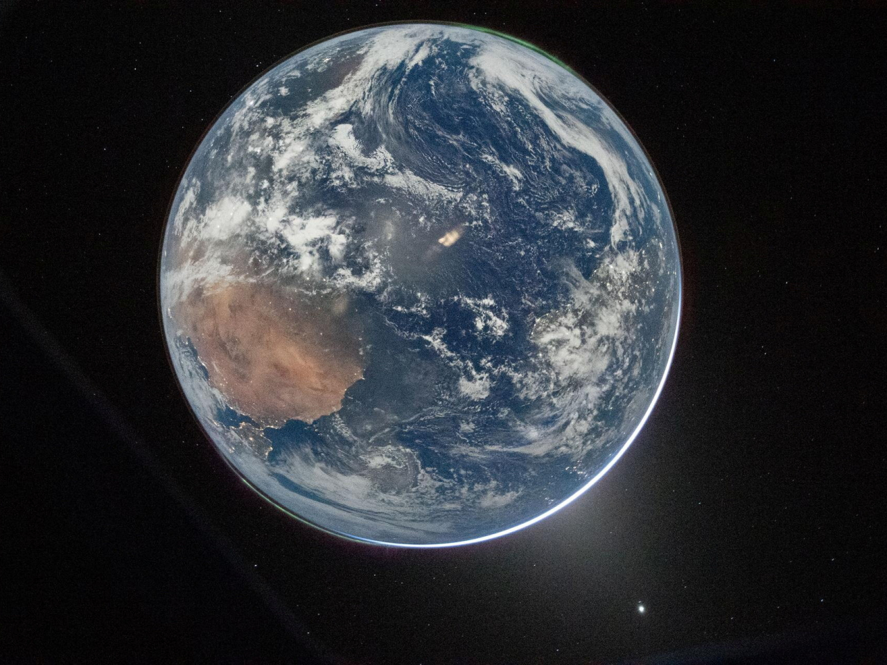 A snapshot of Earth taken by commander Reid Wiseman following the engine firing that catapults the spacecraft on a trajectory around the moon. Photo: Nasa handout/Reuters