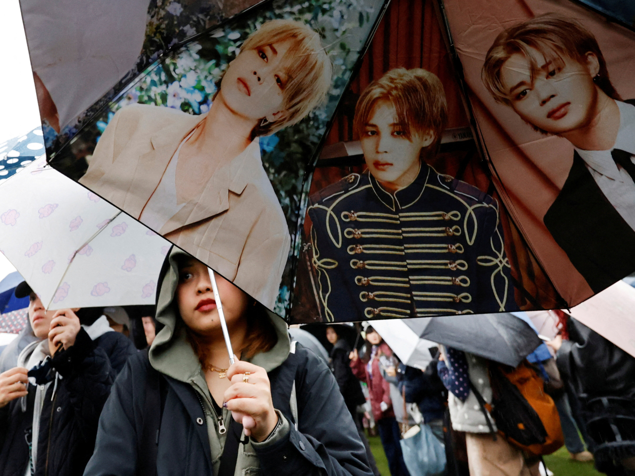 An umbrella with K-pop boy band BTS member Jimin's images as fans of BTS wait in line to enter the concert venue in Goyang, South Korea. Photo: Reuters