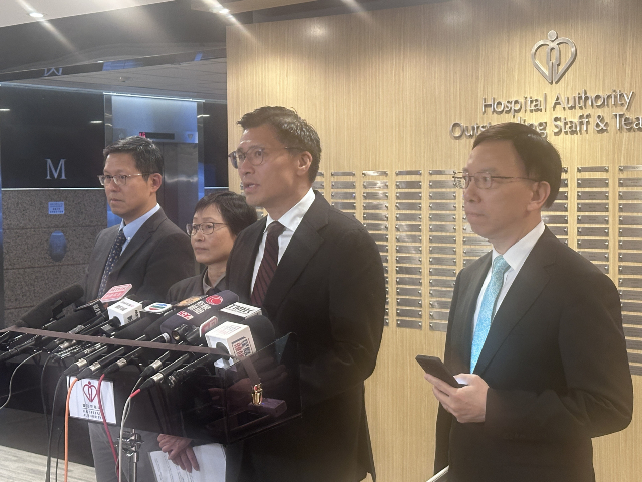 Duncan Chiu (second from right) says the HA will carry out a holistic review of its service supplier management. Photo: RTHK