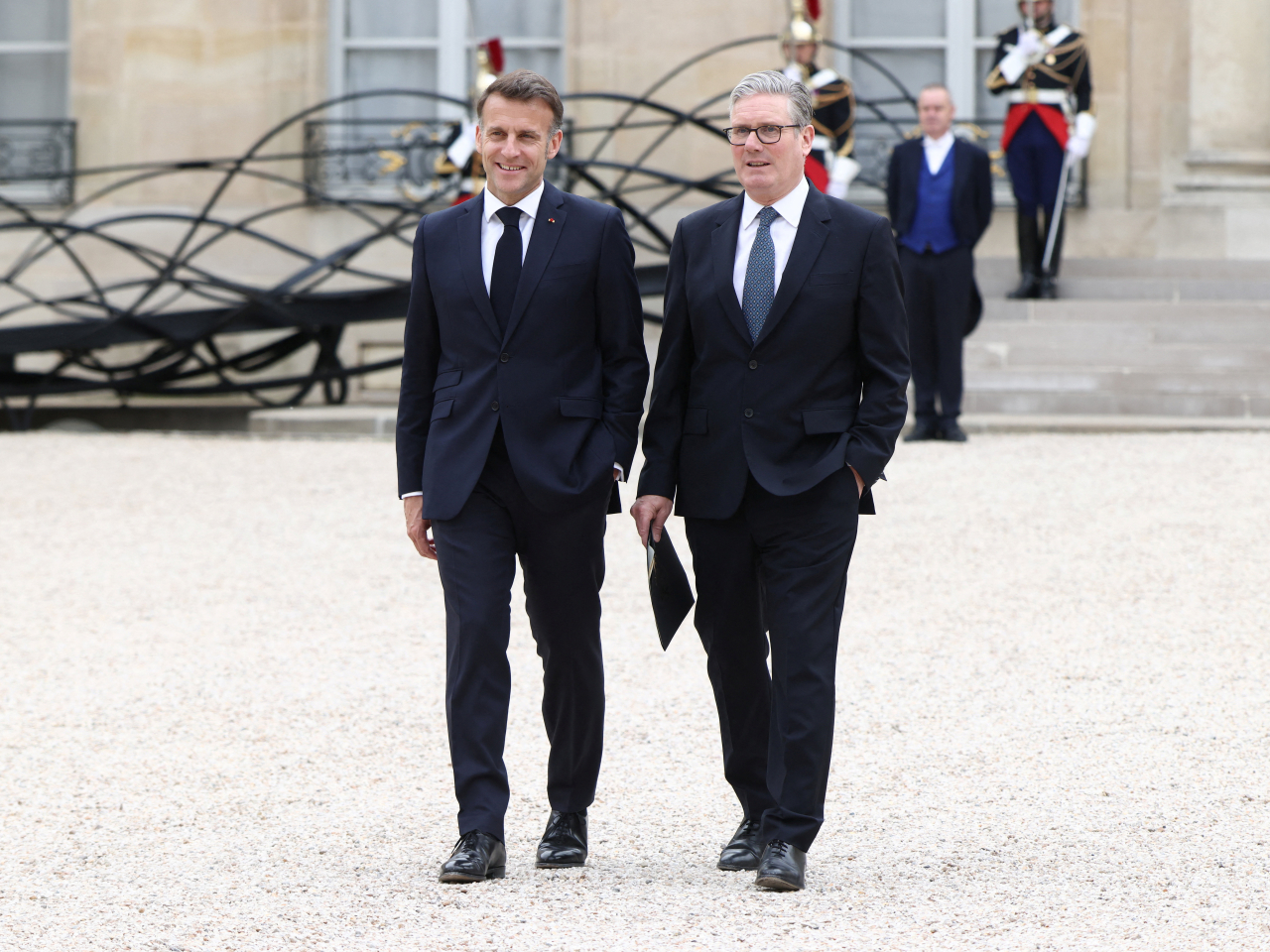 French President Emmanuel Macron and British Prime Minister Keir Starmer after the multinational virtual summit in Paris, France. Photo: Reuters