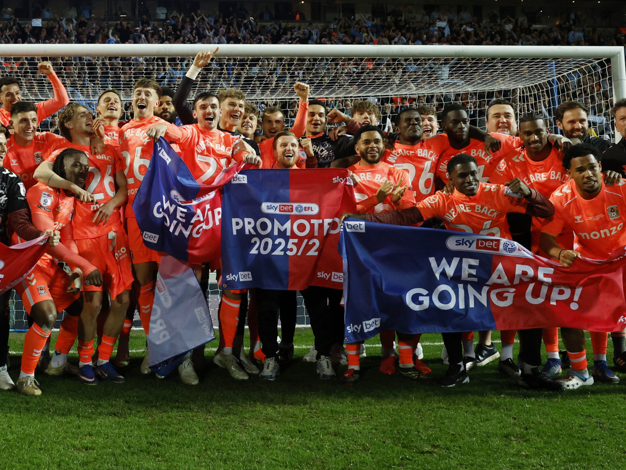 Coventry City's squad and backroom team celebrate after winning promotion to the Premier League at Ewood Park, Blackburn. Photo: Reuters