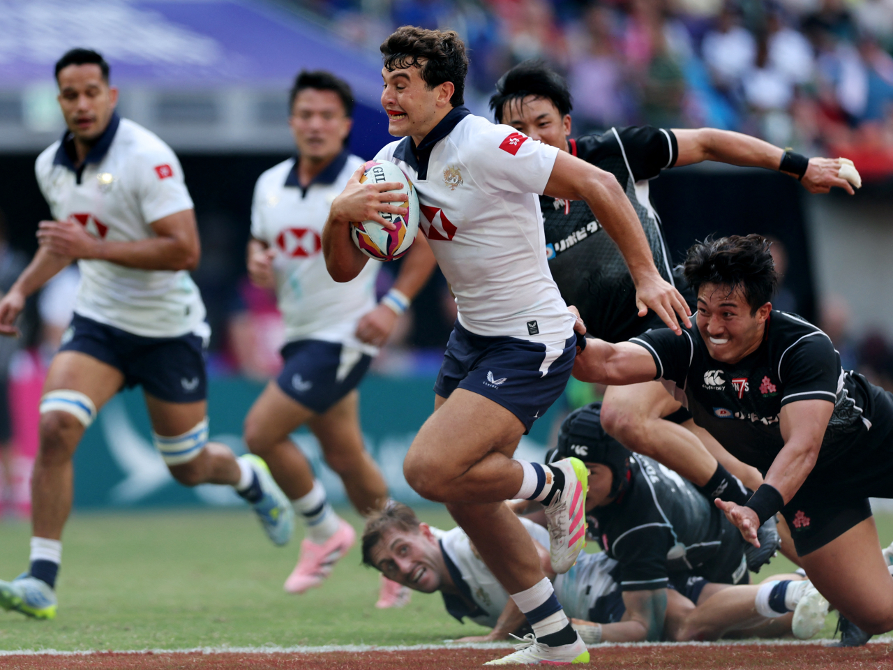 Matteo Avitabile leads the way for Hong Kong, China, in the final with two tries. Photo: Reuters