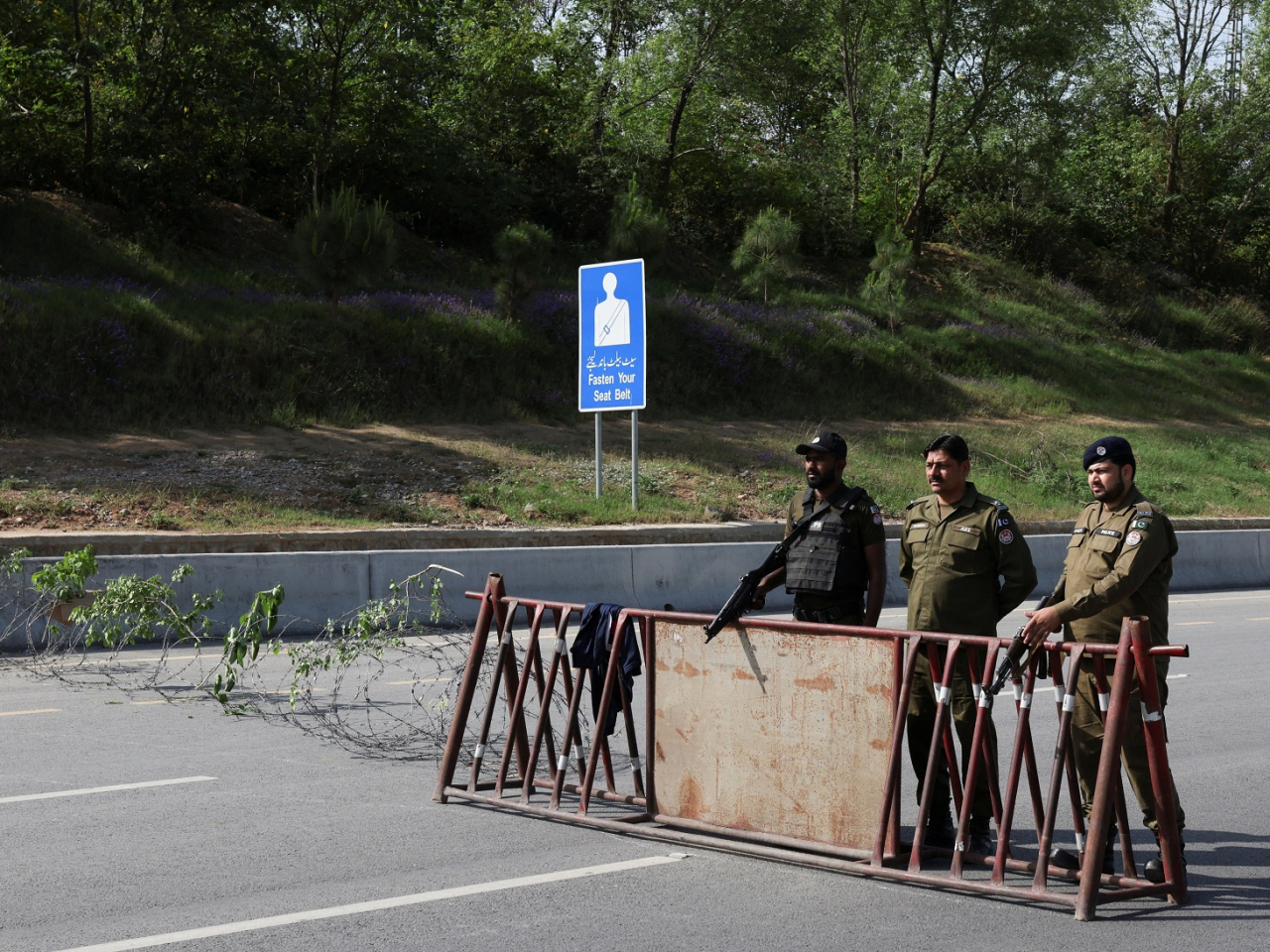 Police officers stand at a security checkpoint along a road as Pakistan prepares to host the US and Iran for the second phase of peace talks in Islamabad. Photo: Reuters
