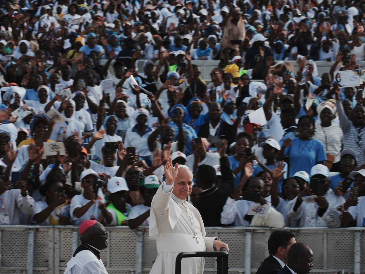 Around 100,000 people attended the Mass, some sleeping on the ground overnight to see the American pope. Photo: Reuters