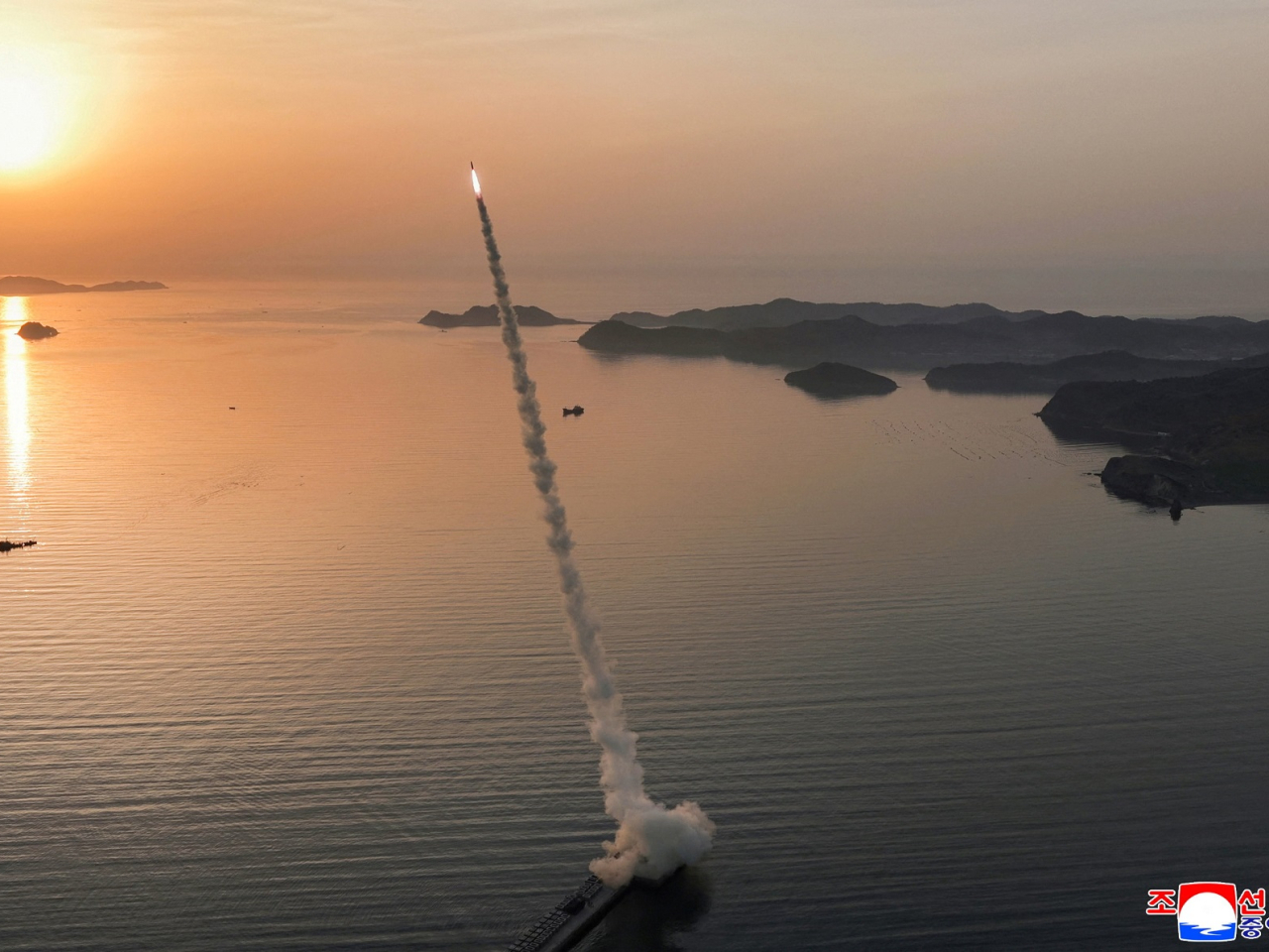 State media said the improved Hwasong-11LA ground-to-ground tactical ballistic missiles flew about 140 km and struck an area of roughly 12.5 to 13 hectares with high density. Photo: KCNA via Reuters