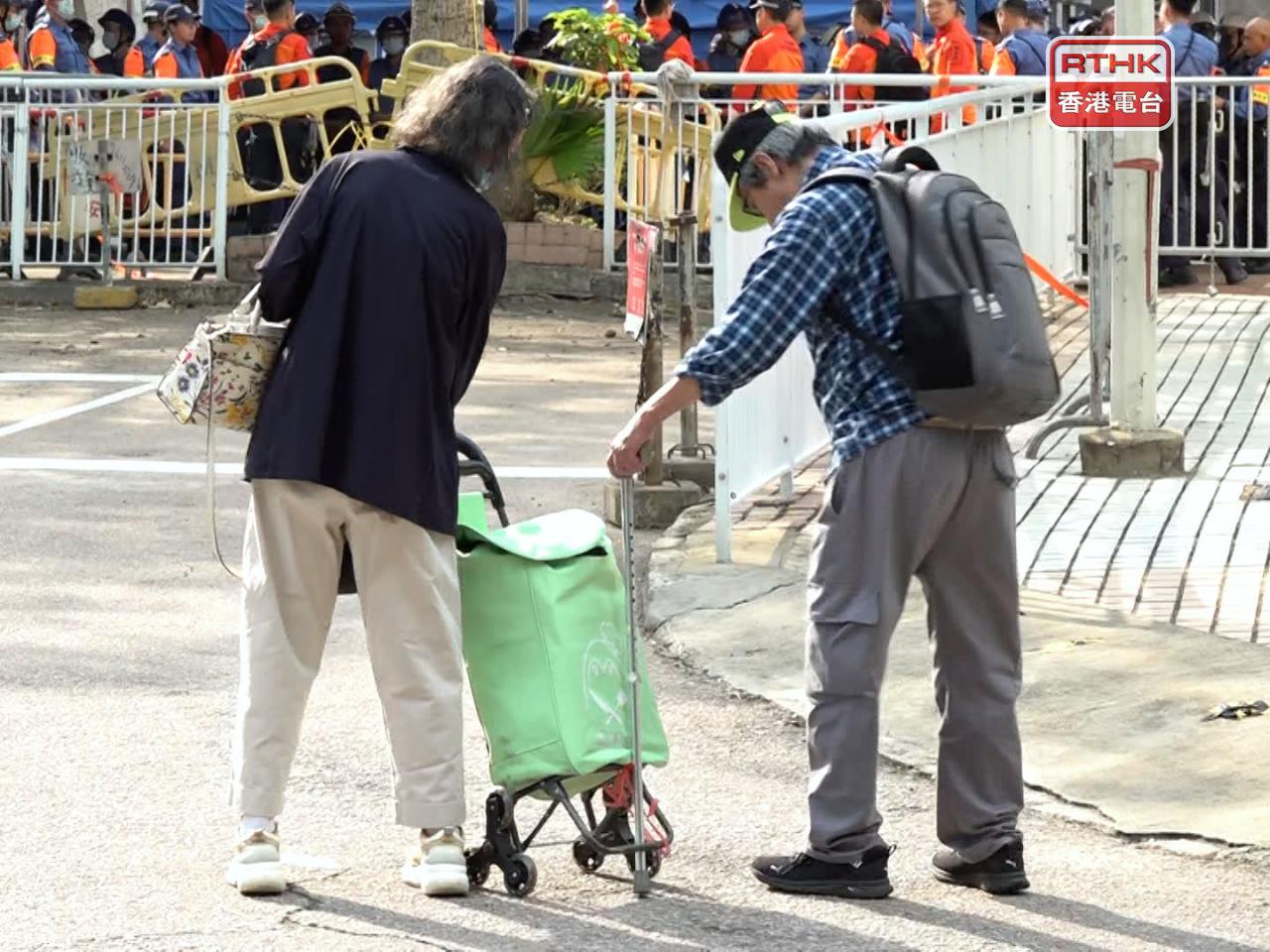 Two Wang Fuk residents prepare to visit their home in Wang Sun House. Photo: RTHK