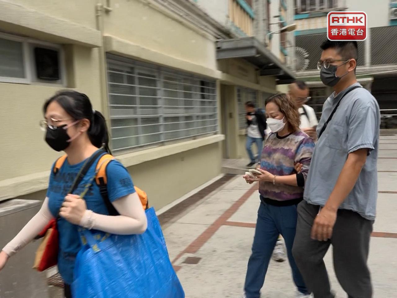 Displaced residents from Wang Cheong House and Wang Yan House return to their homes to salvage belongings. Photo: RTHK