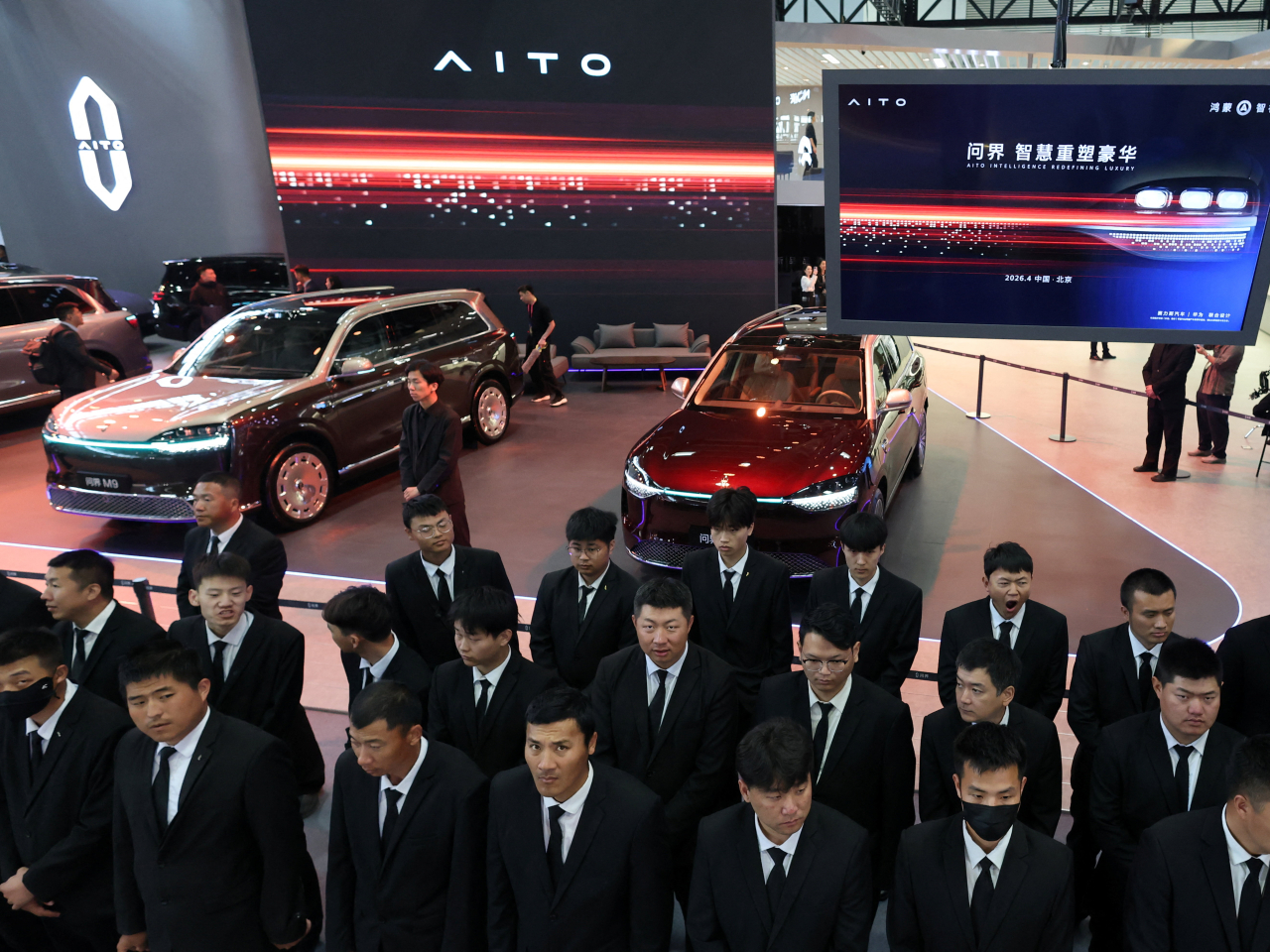 Security staff line up for the start of the Auto China show in Beijing. Photo: Reuters