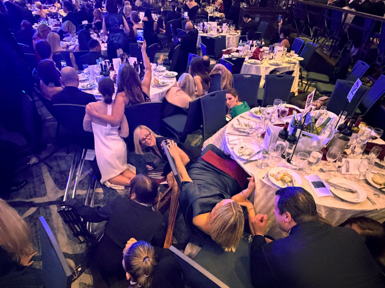 Guests take cover after US President Donald Trump and first lady Melania Trump were rushed out of the White House Correspondents' Association dinner by Secret Service agents. Photo: Reuters