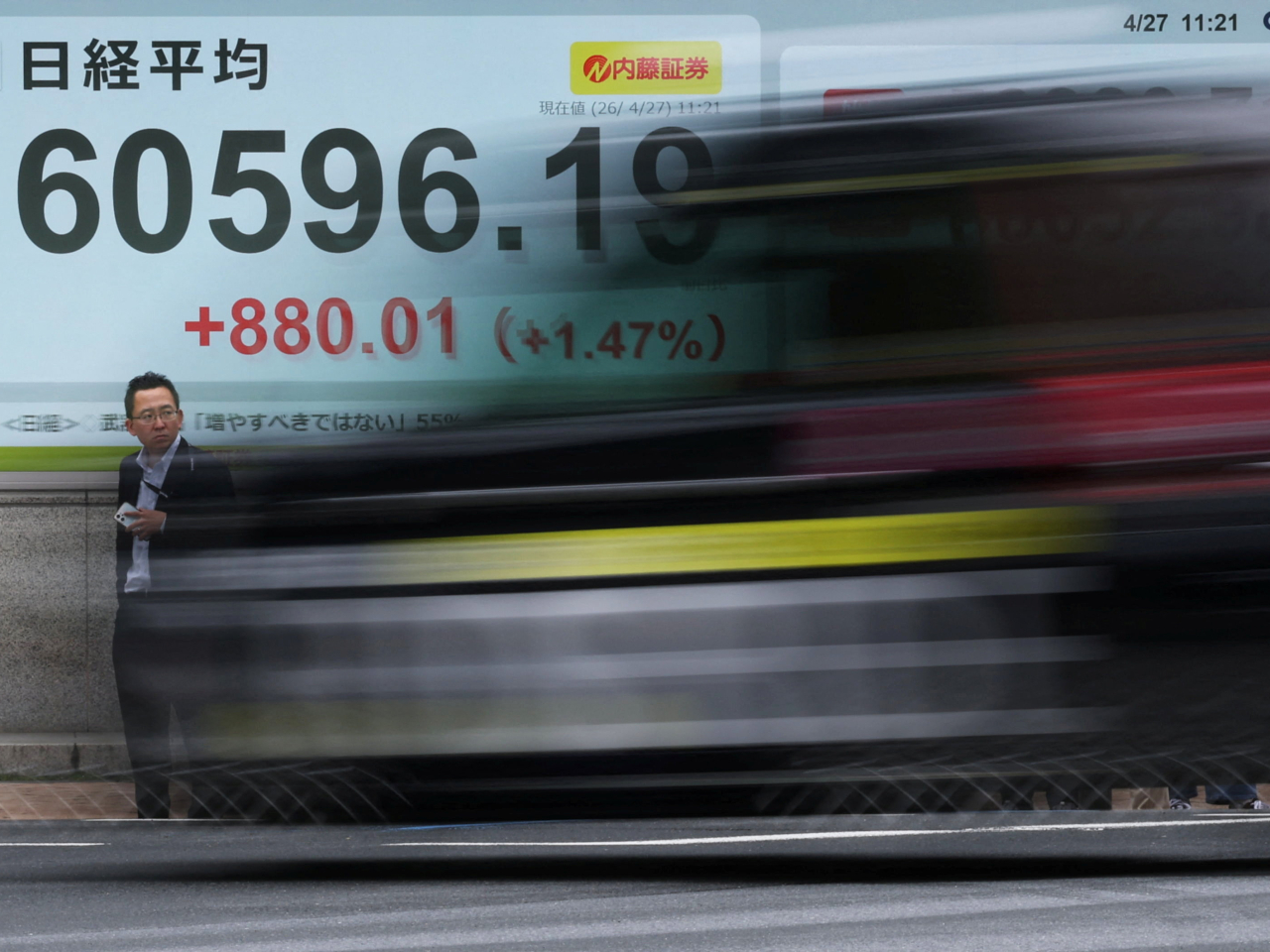 The Nikkei climbed to a record high of 60,596 at one point before noon after opening up 164 points, or 0.28 percent, at 59,880. Photo: Reuters