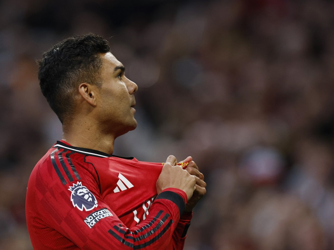 Brazilian star Casemiro, who scored the opener, and he kissed the badge on his jersey as the Old Trafford faithful chanted his name and implored him to stay another season. Photo: Reuters