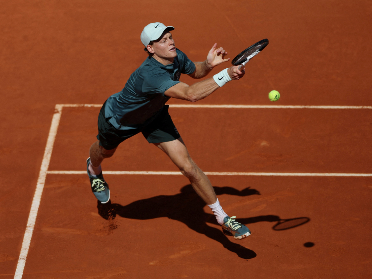 Jannik Sinner goes in for a forehand winner during his semi-final match against Arthur Fils in Madrid. Photo: Reuters