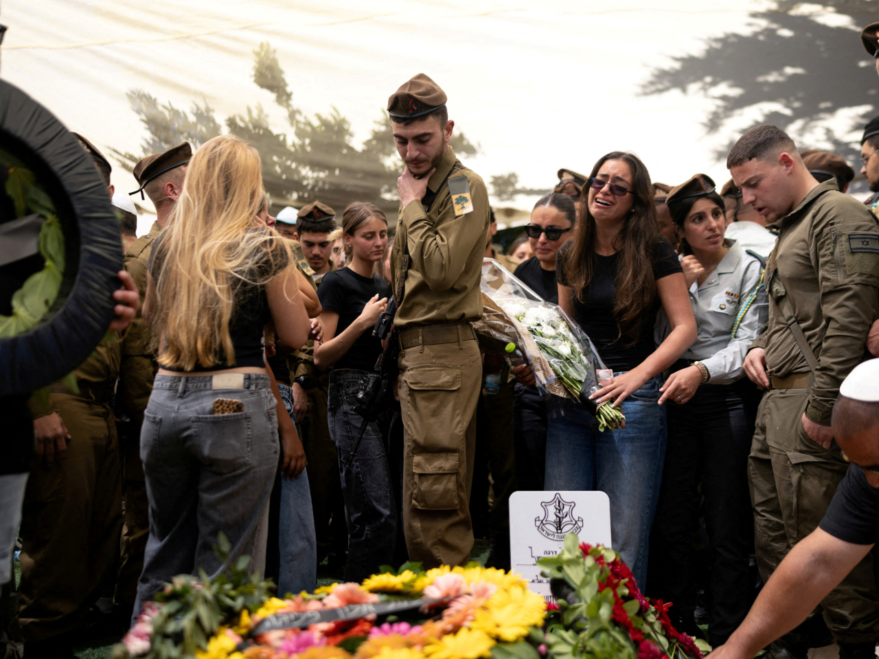 Friends and relatives mourn in Herzliya, Israel, at the funeral of a soldier killed in combat in southern Lebanon. Photo: Reuters