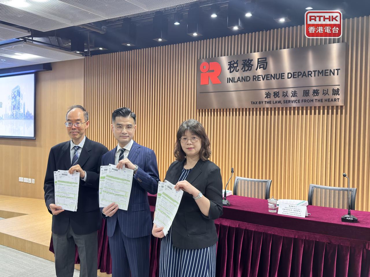 Commissioner Benjamin Chan, centre, says stamp duty revenue surged due to the rise in both property and stock transactions. Photo: RTHK