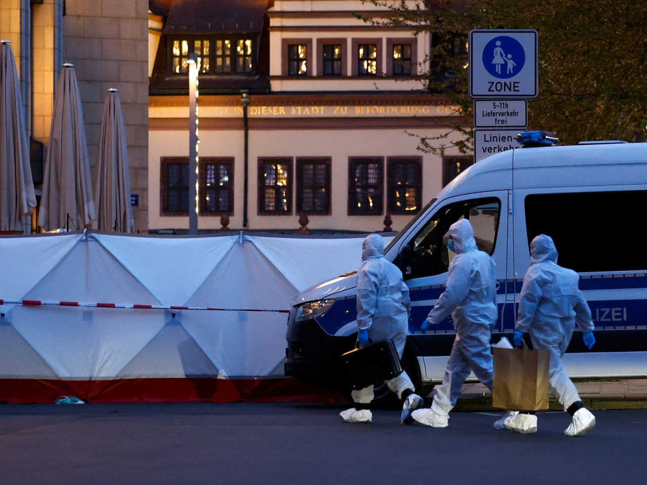 A forensic team works at the site where a car drove into a group of people in Leipzig. Photo: Reuters