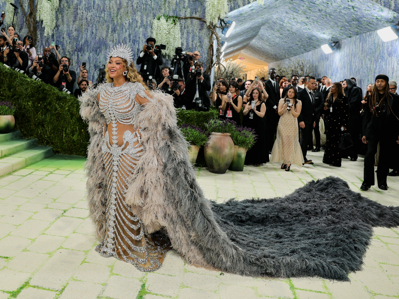 Beyonce stuns in a bejeweled skeleton gown topped with a dramatic feather coat and a headpiece at the Met Gala in New York. Photo: Reuters
