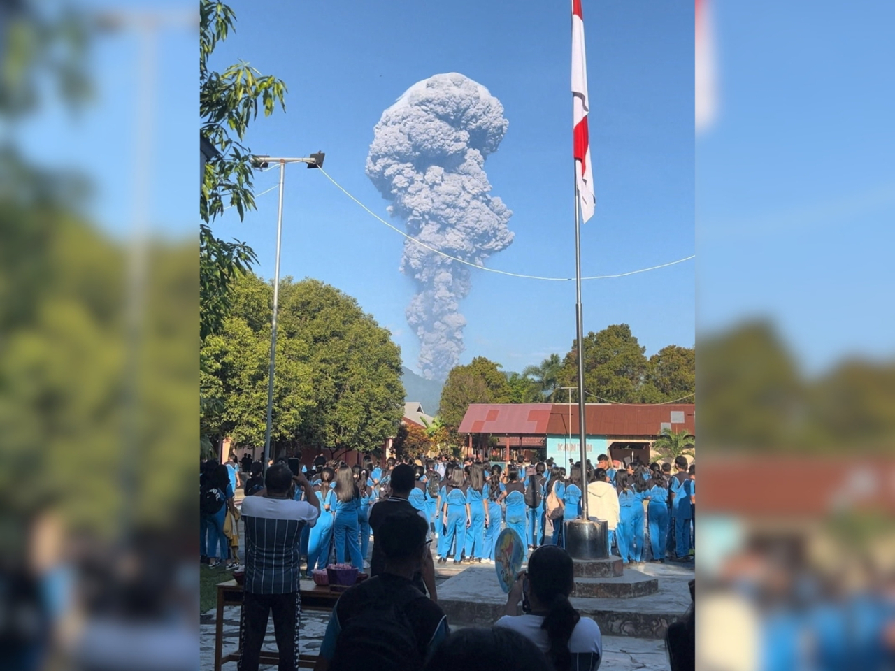 Indonesians watch as Mount Dukono erupts in North Halmahera Regency, North Maluku. Photo: Reuters