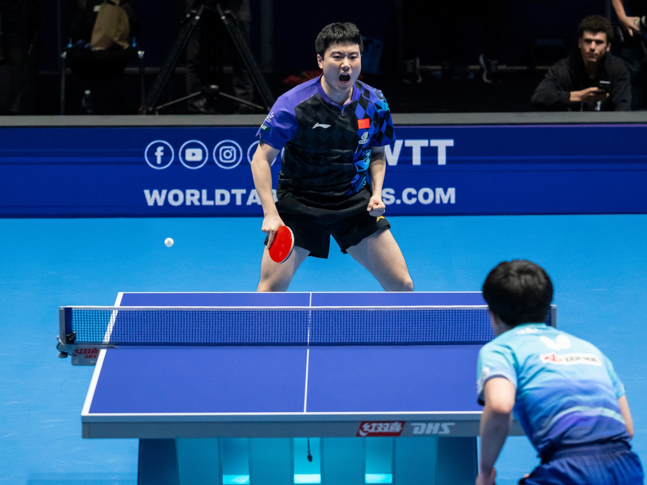 Liang Jingkun set the tone for China after his remarkable comeback victory against Japan's Tomokazu Harimoto. Photo: Xinhua