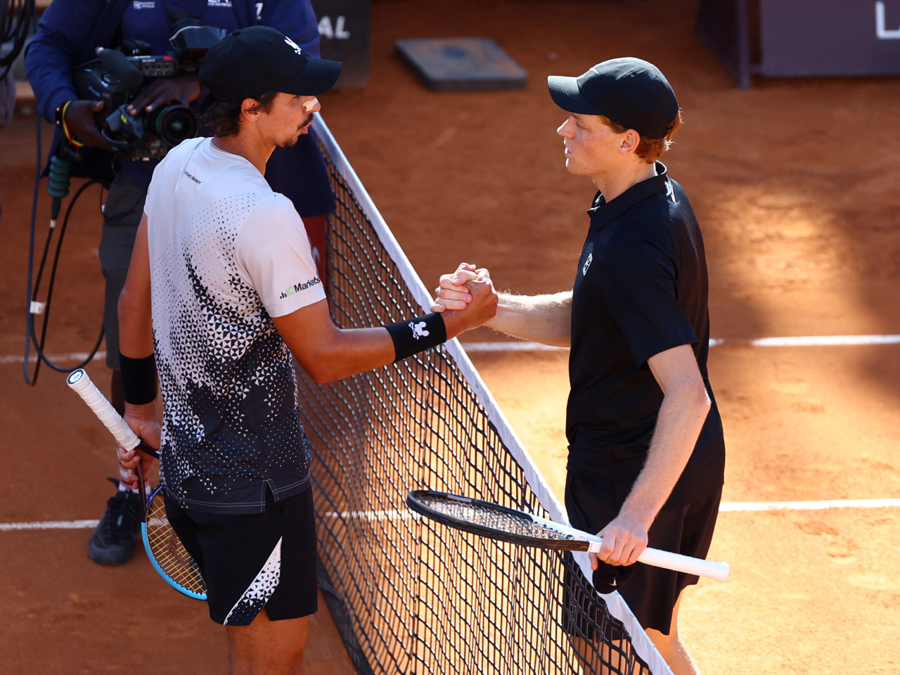 Sinner, right, needed just over an hour to defeat Australia's Alexei Popyrin, who is ranked 60th in the world. Photo: Reuters