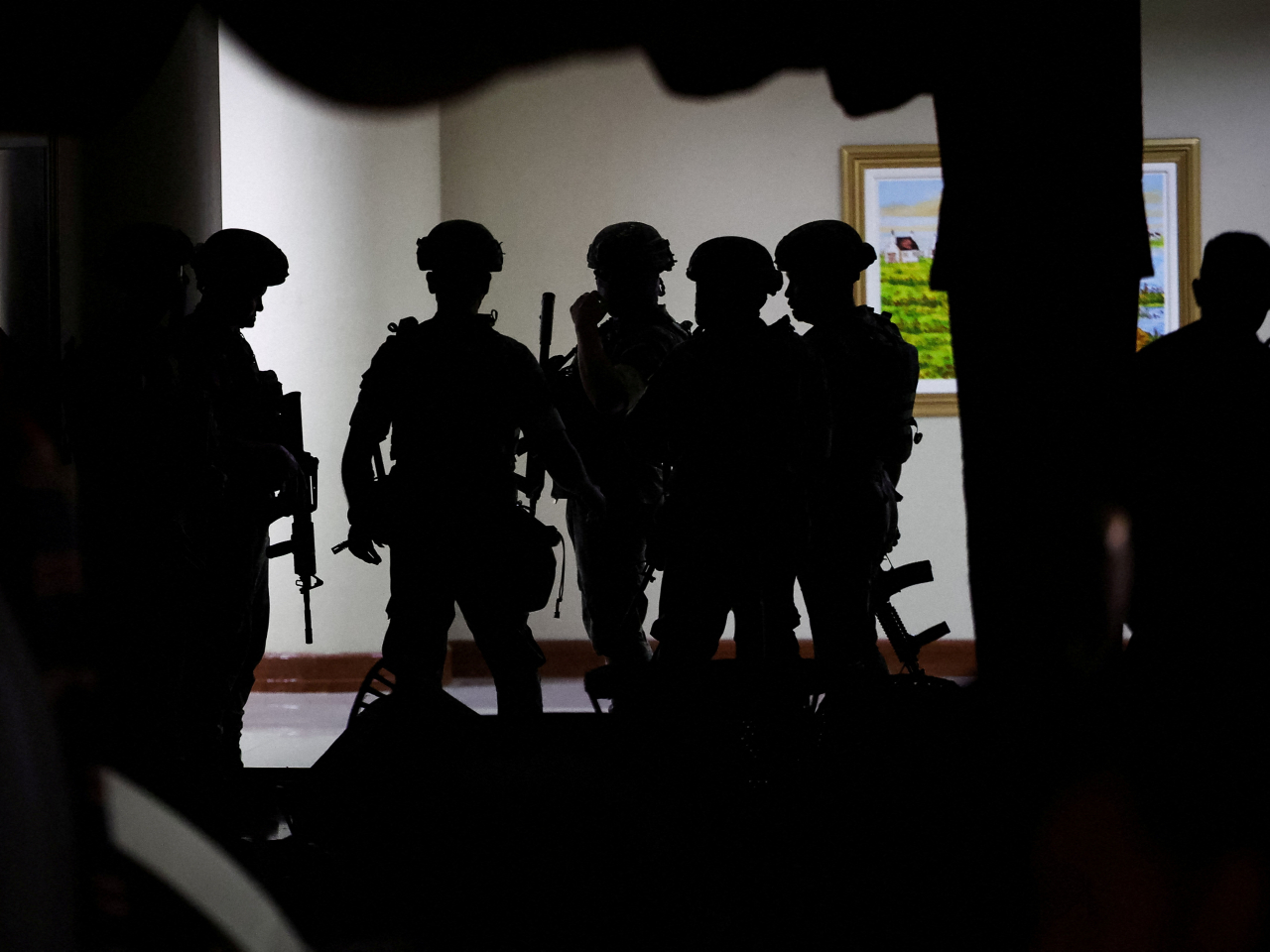 At least five shots rang out, minutes after soldiers with rifles and protective gear went up the stairs of the senate building. Photo: Reuters