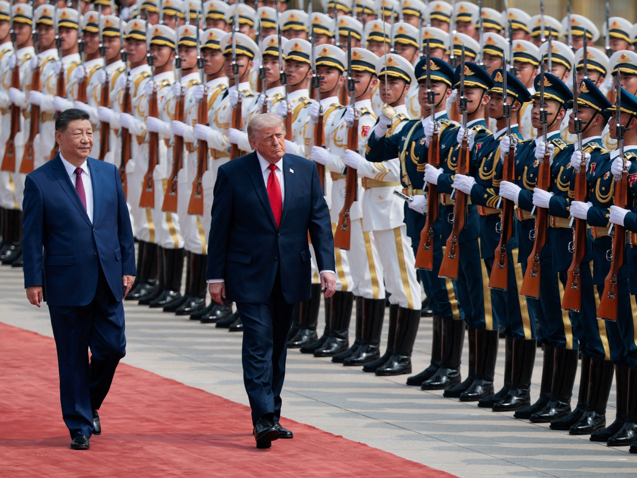 President Xi Jinping and his US counterpart Donald Trump inspect an honour guard during a welcome ceremony on Thursday morning. Photo: Reuters