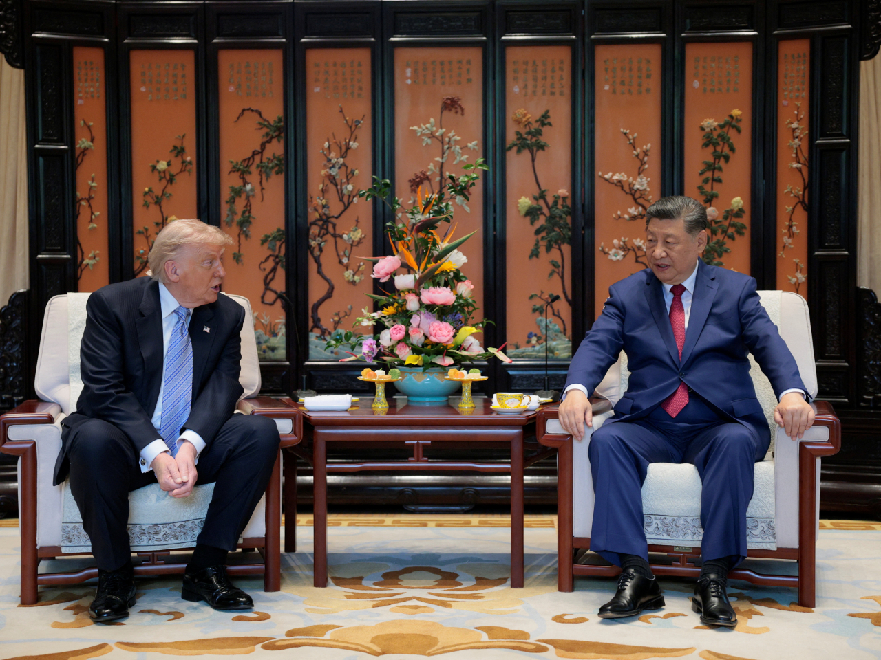 Xi Jinping and Donald Trump sit down for a talk after their walk around Zhongnanhai. Photo: Reuters