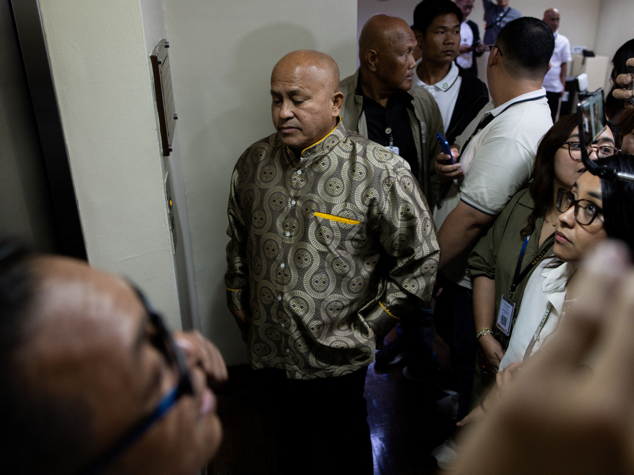 Fugitive senator Ronald Dela Rosa is surrounded by supporters and the media while under 'protective custody' in the senate in Manila. Photo: Reuters