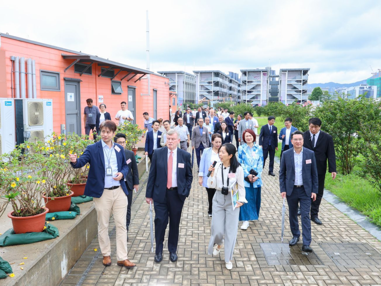 Representatives from consulates-general and foreign chambers of commerce are given a tour of the Runway 1331 hostel area. Photo courtesy of DAB