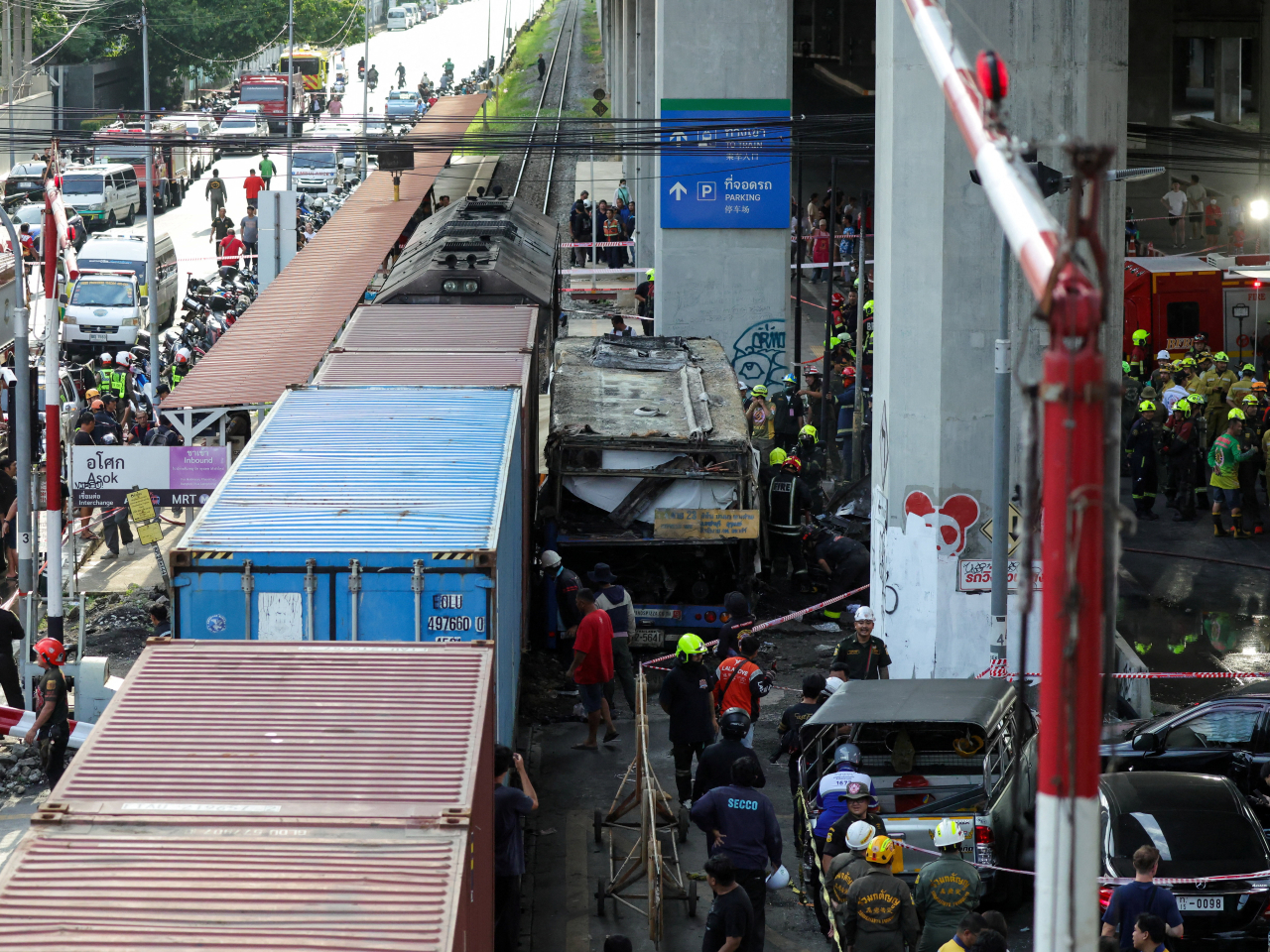 Eight people were killed and 30 injured in the collision between the freight train and a bus in Bangkok on Saturday. Photo: Reuters