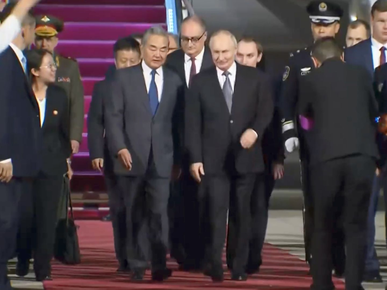 Russian President Vladimir Putin is greeted by Foreign Minister Wang Yi at the airport. Photo: Reuters