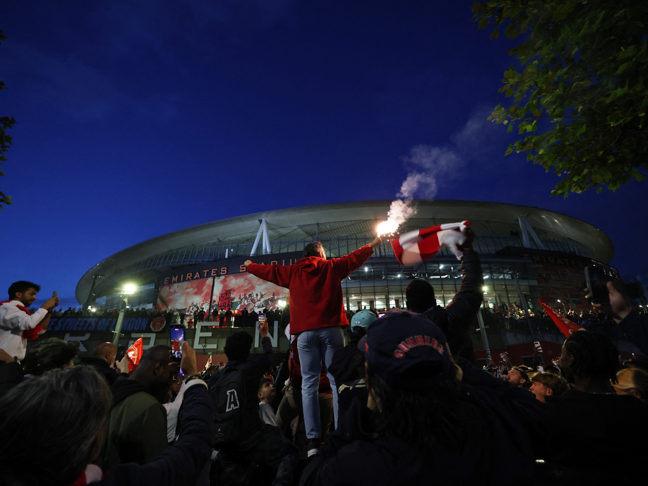 Fans in north London erupted in celebration following Arsenal's first Premier League title since 2003-04. Photo: Reuters