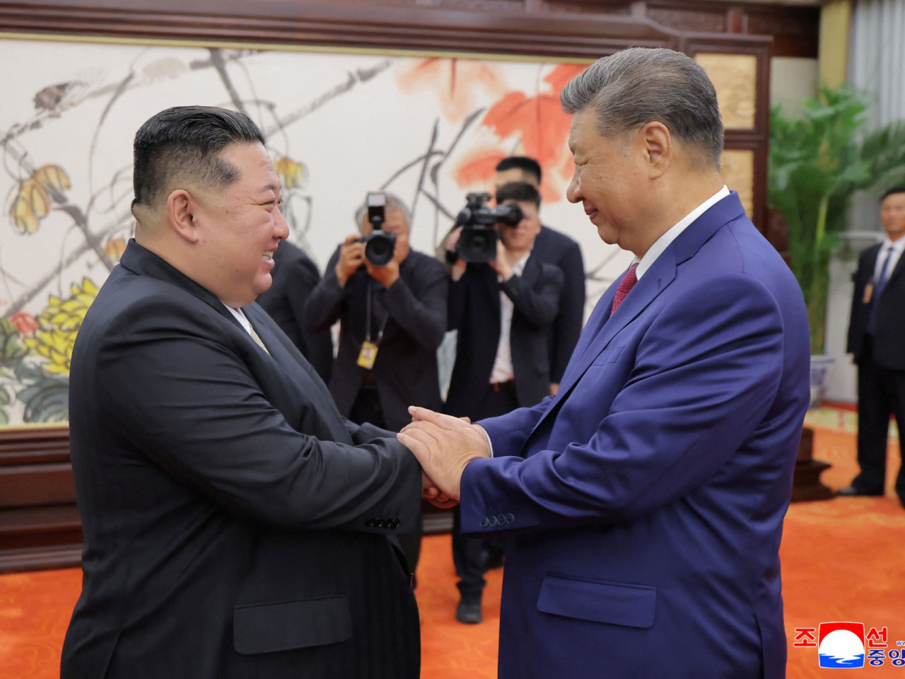 金正恩去年9月曾訪問北京，與習近平會面。（法新社資料圖片）