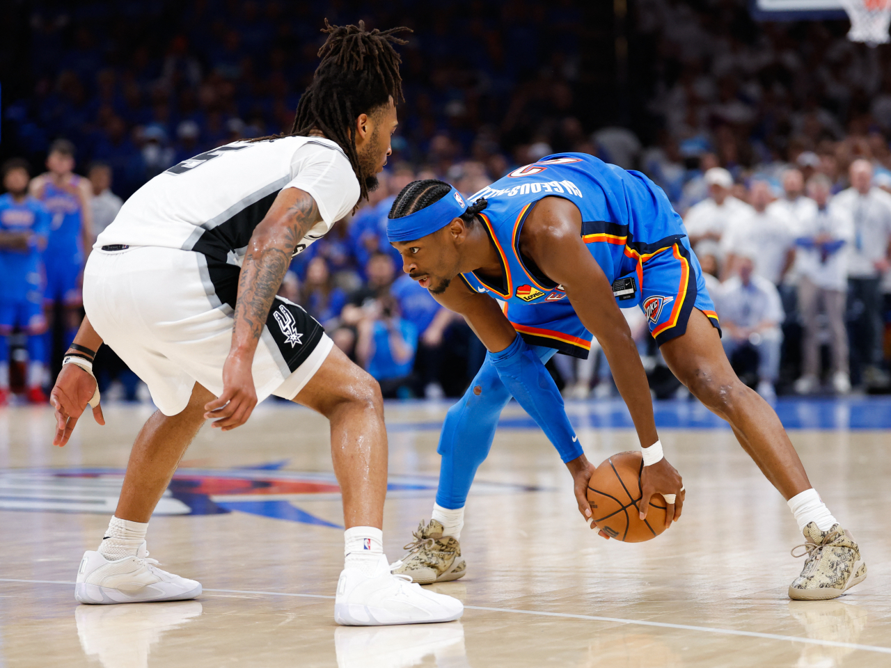 Reigning MVP Shai Gilgeous-Alexander, right, tallied a near double-double of 30 points and nine assists in the Thunder victory. Photo: Reuters