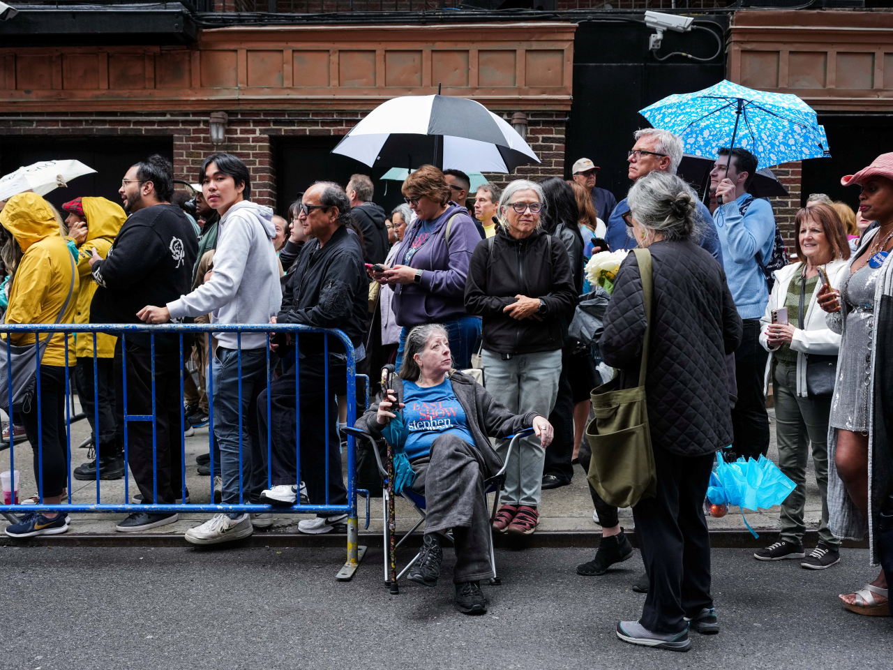 A long line forms outside the Ed Sullivan Theatre in New York City ahead of Stephen Colbert's swansong. Photo: Reuters