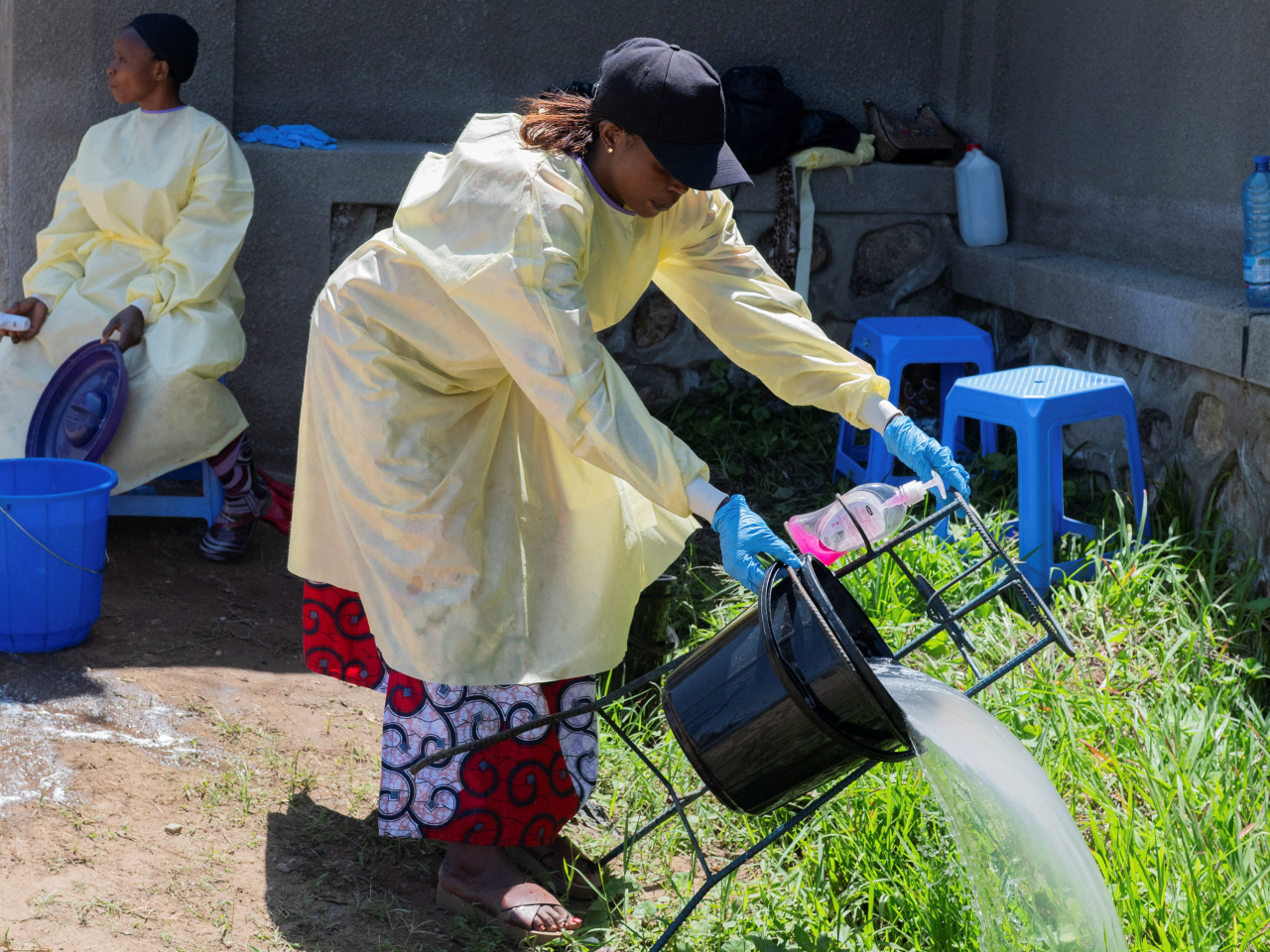 A Congolese health worker handles a hand washing station in the Democratic Republic of the Congo. Photo: Reuters
