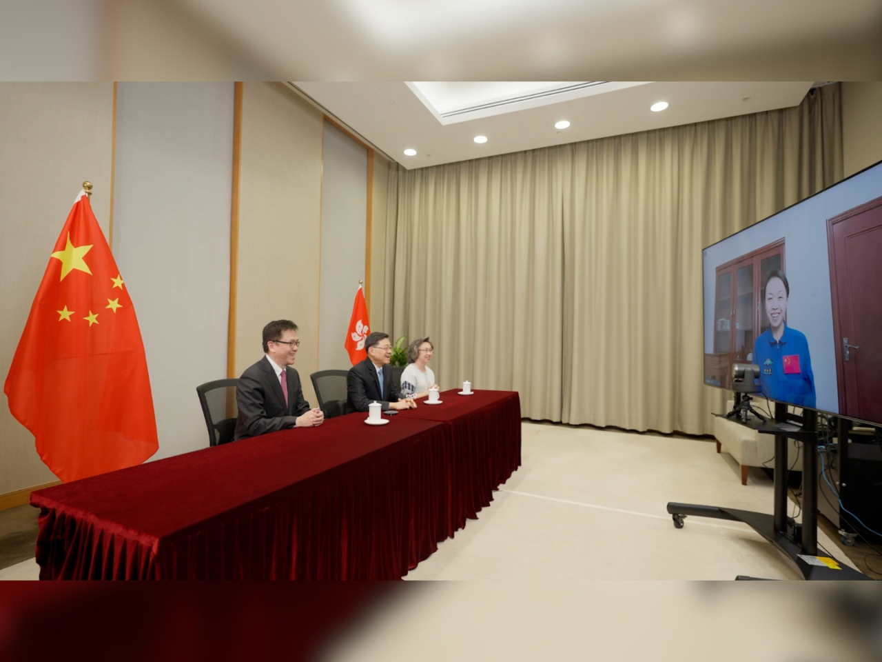 John Lee, Sun Dong and Ingrid Yeung speak with Lai Ka-ying in a video call. Photo courtesy of the Chief Executive's Office