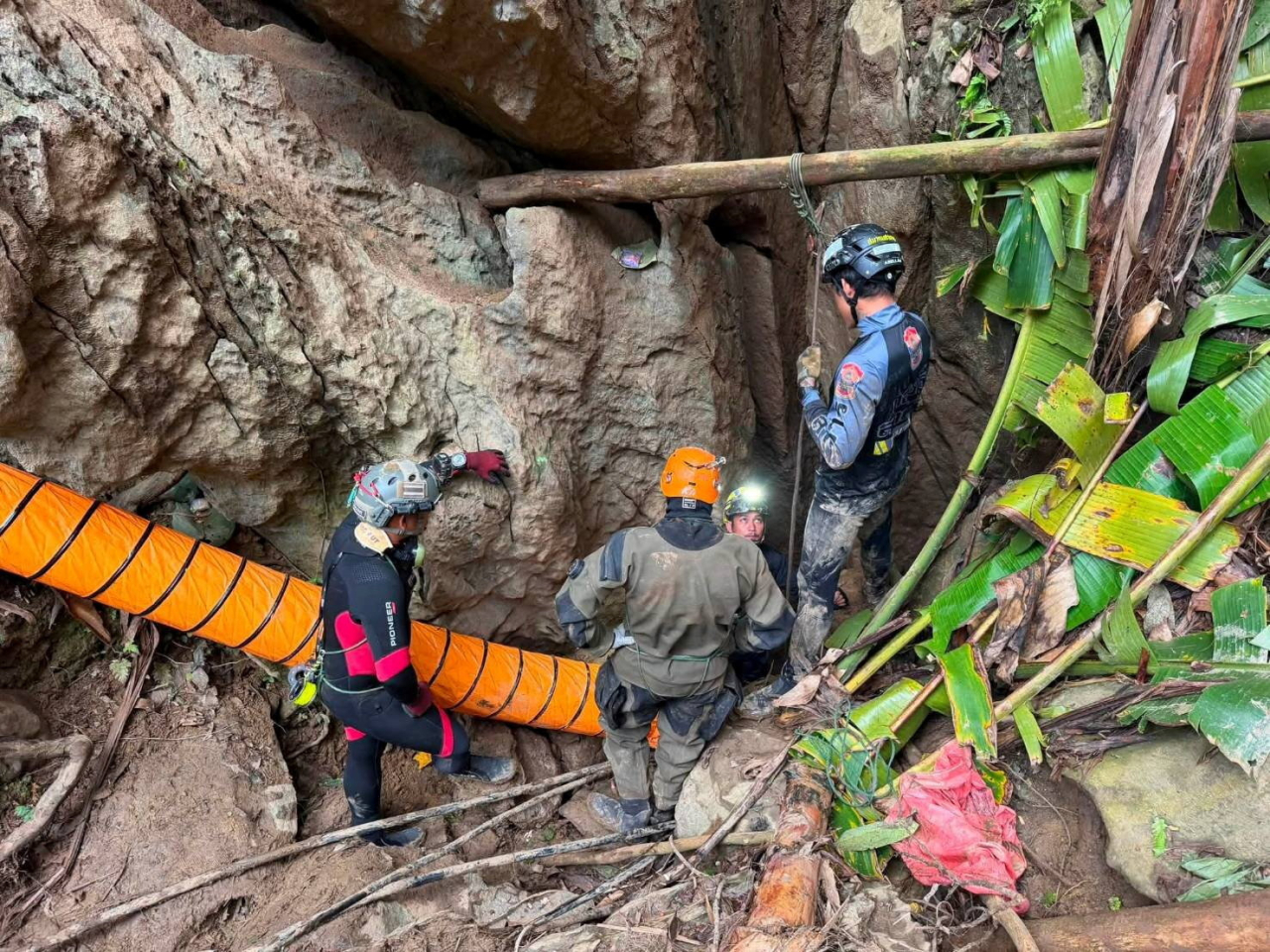 Members of a rescue team work to save seven people trapped in a cave, at a location given as Xaisomboun Province, Laos. Photo: Reuters