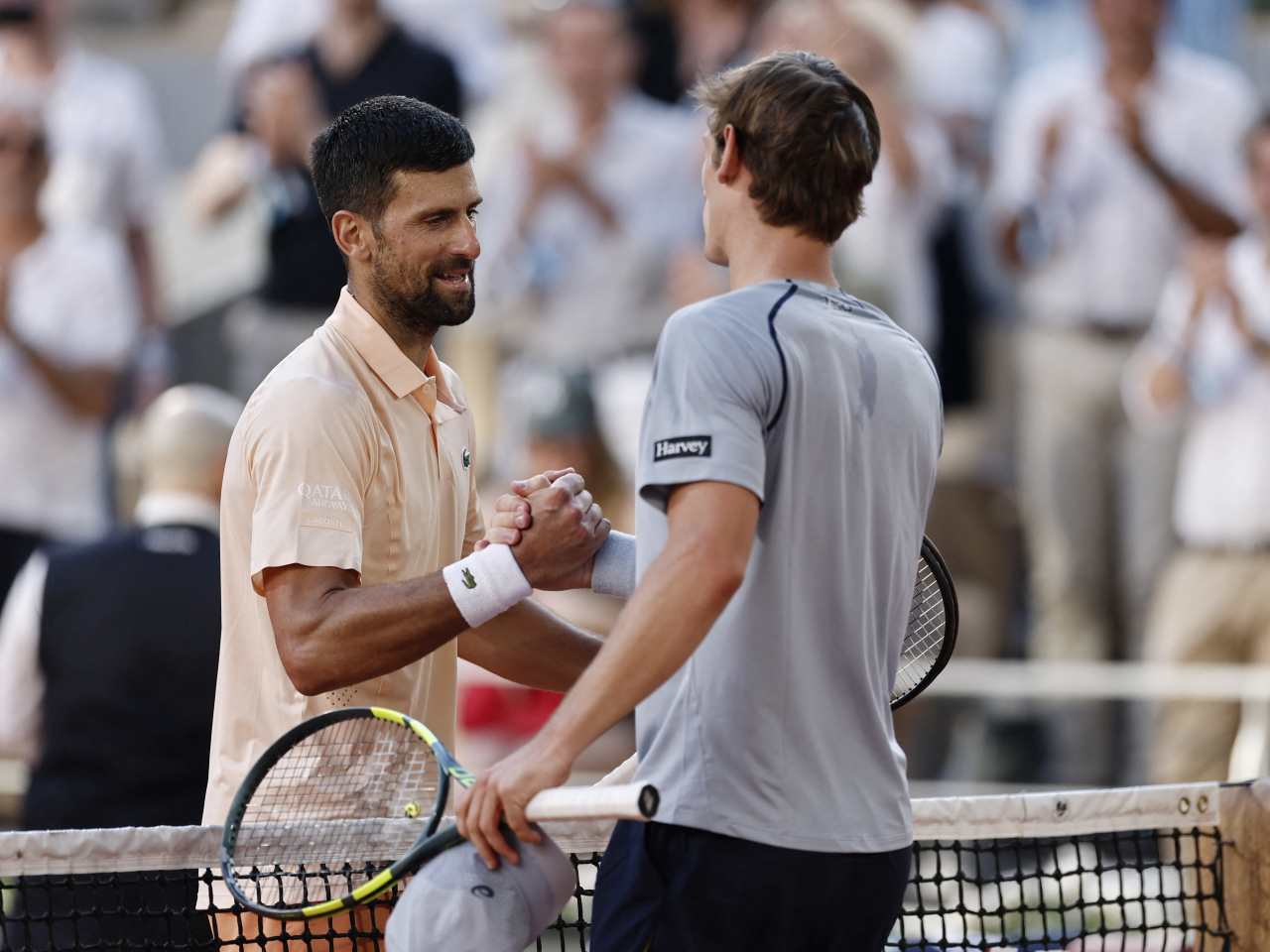 Djokovic battled through sweltering conditions to move past Frenchman Valentin Royer in four sets. Photo: Reuters