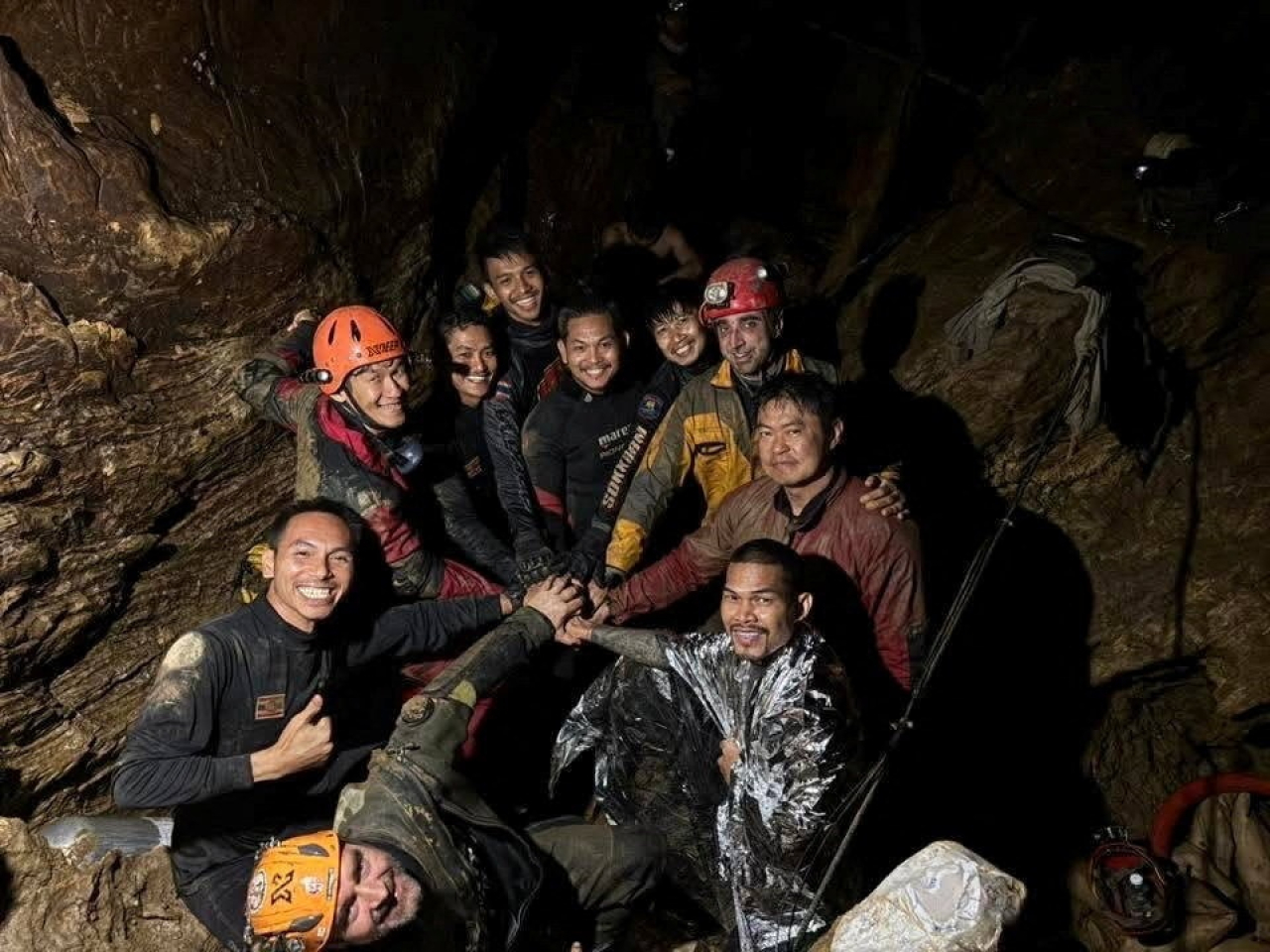 Rescuers pose for a photo as they work to save trapped people in a cave in Xaisomboun Province, Laos. Photo: Reuters