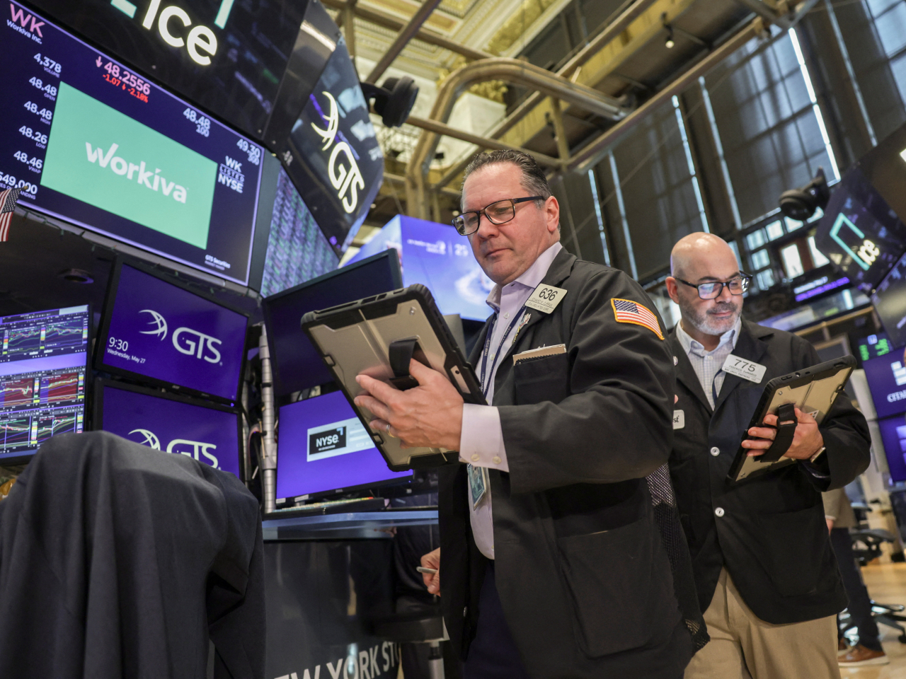 Ending higher on Friday are the Dow, up 0.72 percent at 51,032, the S&P 500, up 0.22 percent to 7,580, and the Nasdaq, up 0.21 percent at 26,972. File photo: Reuters
