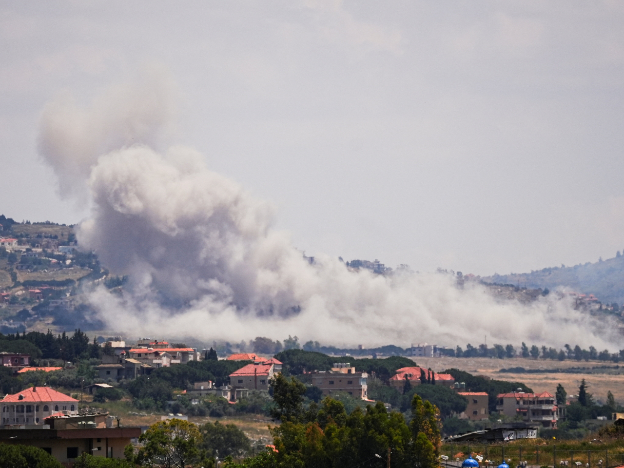 Smoke billows from a southern Lebanon village following an Israeli strike. Photo: Reuters