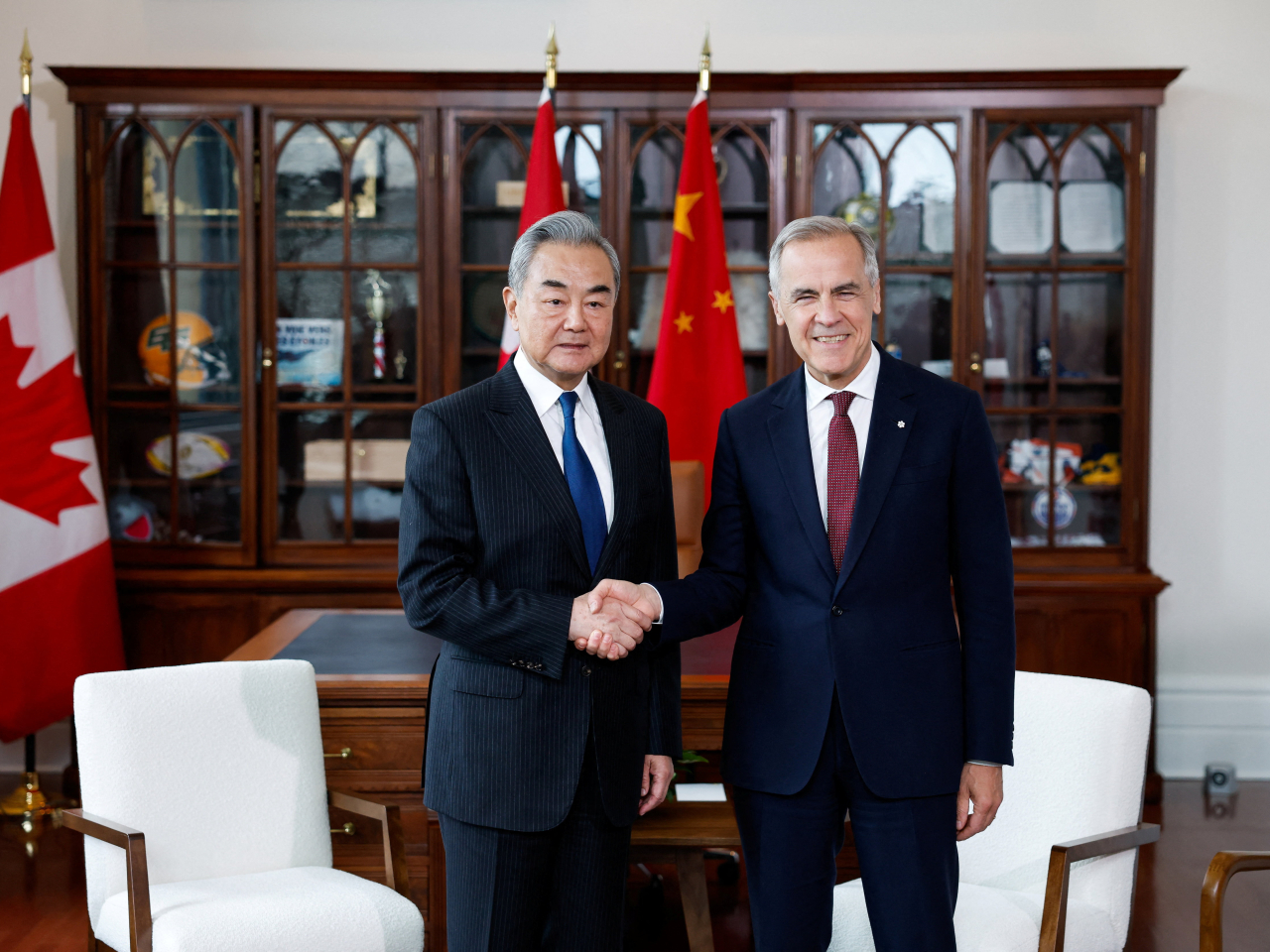 Wang Yi calls on Mark Carney at his office in Ottawa. Photo: Reuters
