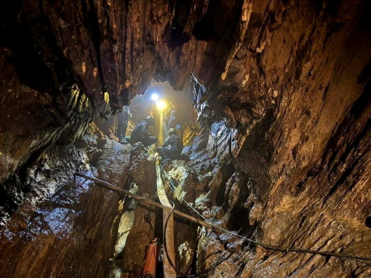 Rescuers work their way into the cave system in Xaisomboun, Laos, where two more people are still trapped. Photo: Reuters