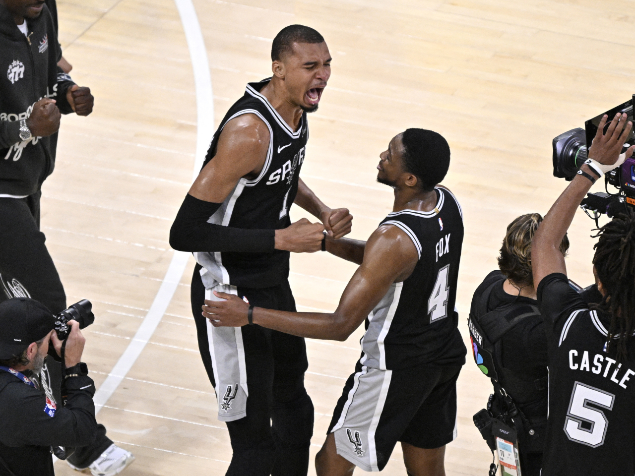 San Antonio Spurs forward Victor Wembanyama, left, celebrates with De'aaron Fox after defeating the Oklahoma City Thunder in the western conference finals. Photo: Reuters