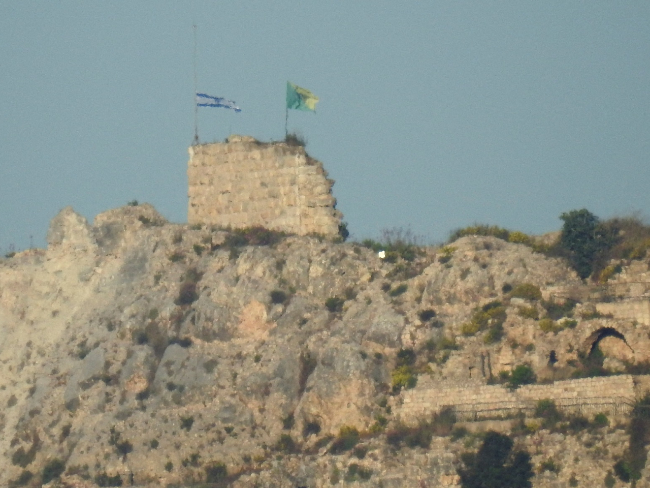 An Israeli flag and a flag of the Golani Brigade are raised on Beaufort Castle, as seen from Marjayoun, southern Lebanon. Photo: Reuters