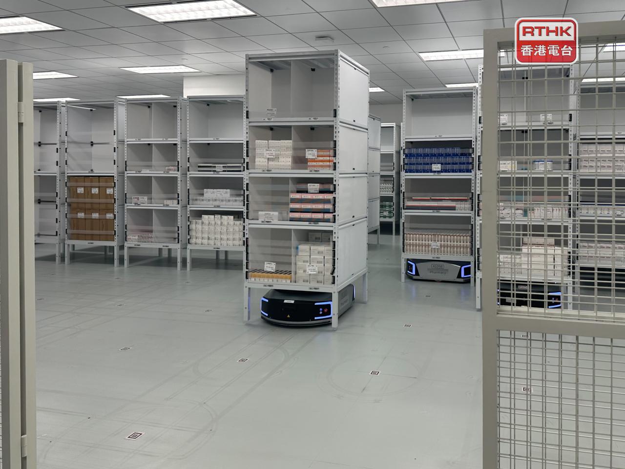 Automated robots lift drug shelves to bring them to workstations at the North District Community Health Centre. Photo: RTHK