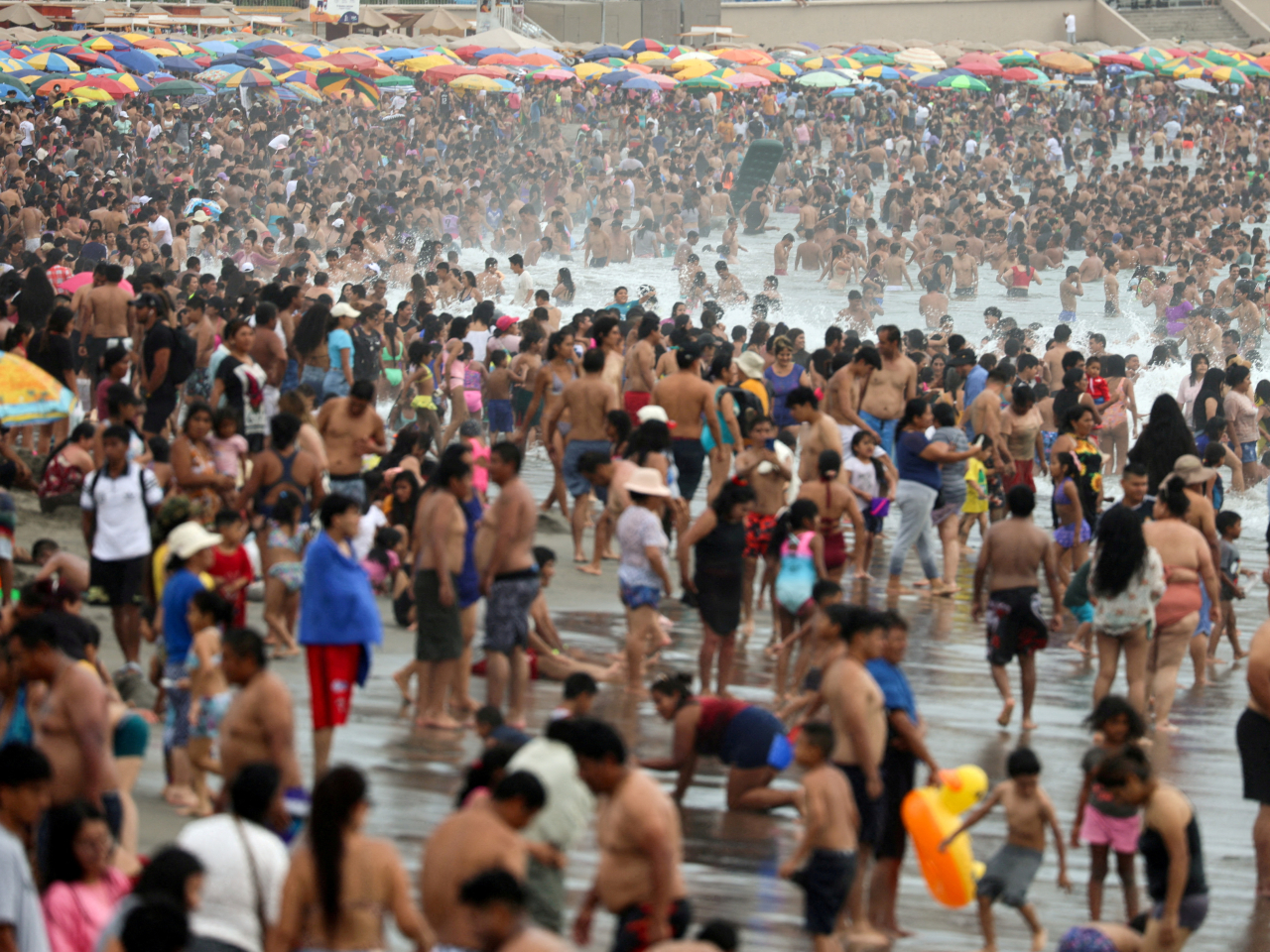 People stay cool at the beach in Lima, Peru. The UN has urged countries to be wary of El Nino, which would bring extreme heat. File photo: Reuters