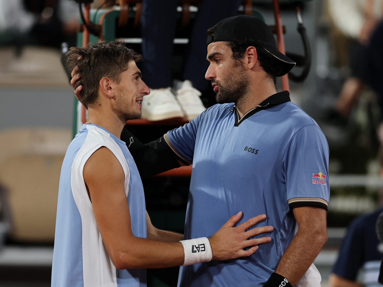 Arnaldi, left, was leading 5-2 in the second set when a hip problem forced Berrettini to end the match early. Photo: Reuters