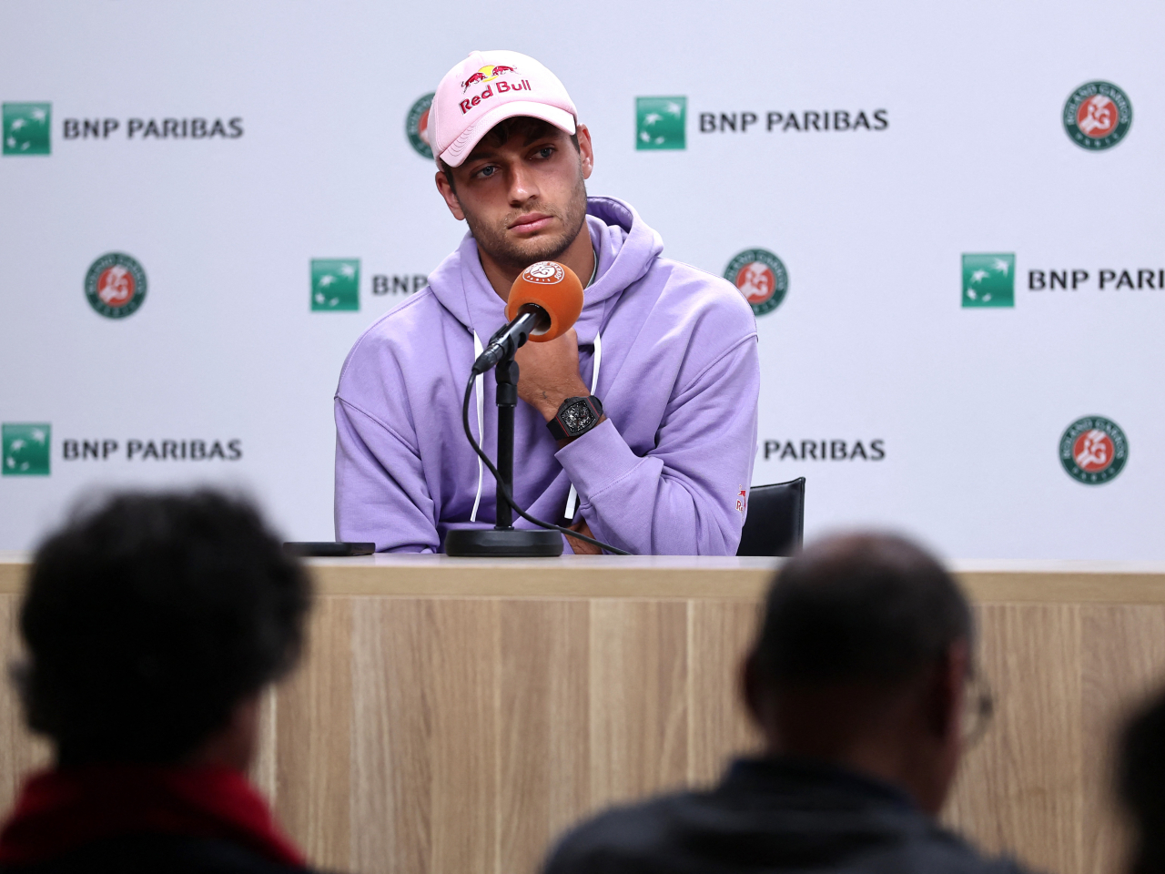 Italy's Flavio Cobolli speaks to journalists after advancing to the French Open men's singles final following the retirement of compatriot Matteo Arnaldi. Photo: Reuters