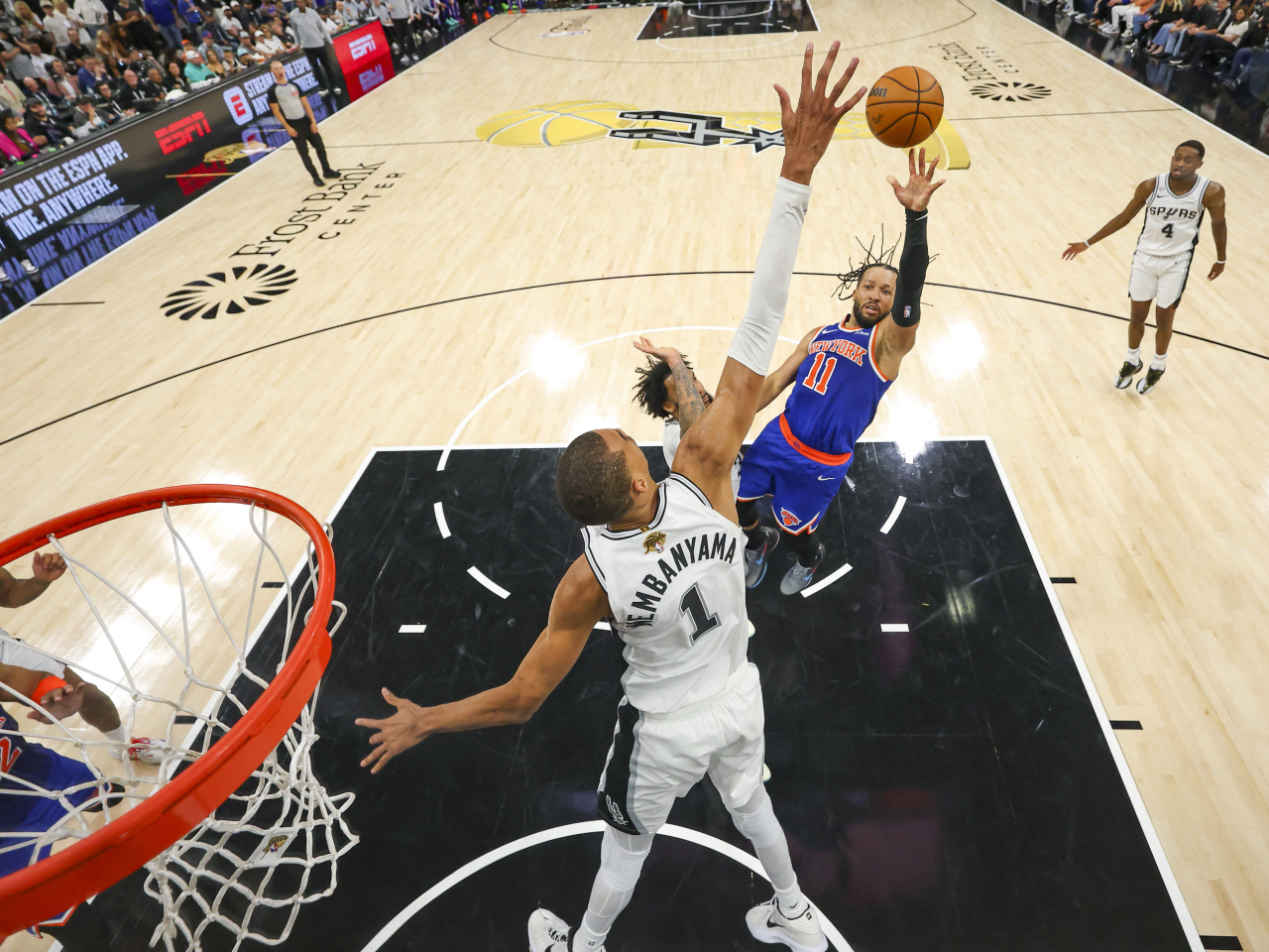 Victor Wembanyama tries to block a Jalen Brunson shot in San Antonio, Texas. Photo: Gregory Shamus via Imagn Images/Reuters